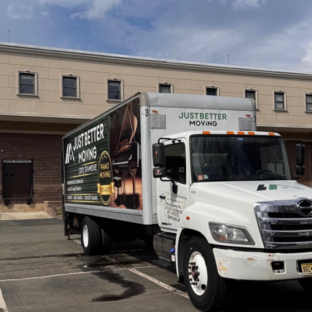Just Better Moving box truck with its piano moving specialists wrap