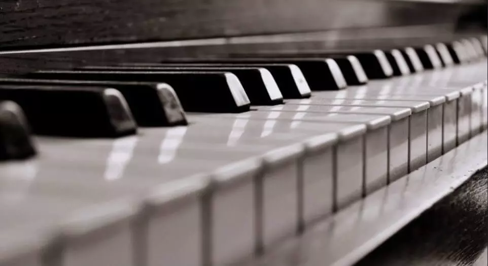 Close-up of the keys of an acoustic piano